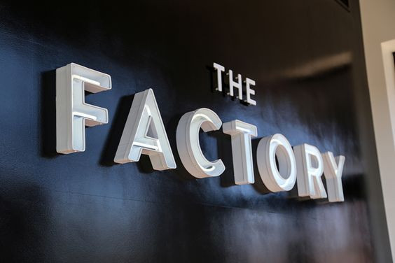 Logotype and neon signage for Oklahoma City fashion store The Factory graphic design studio Ghost